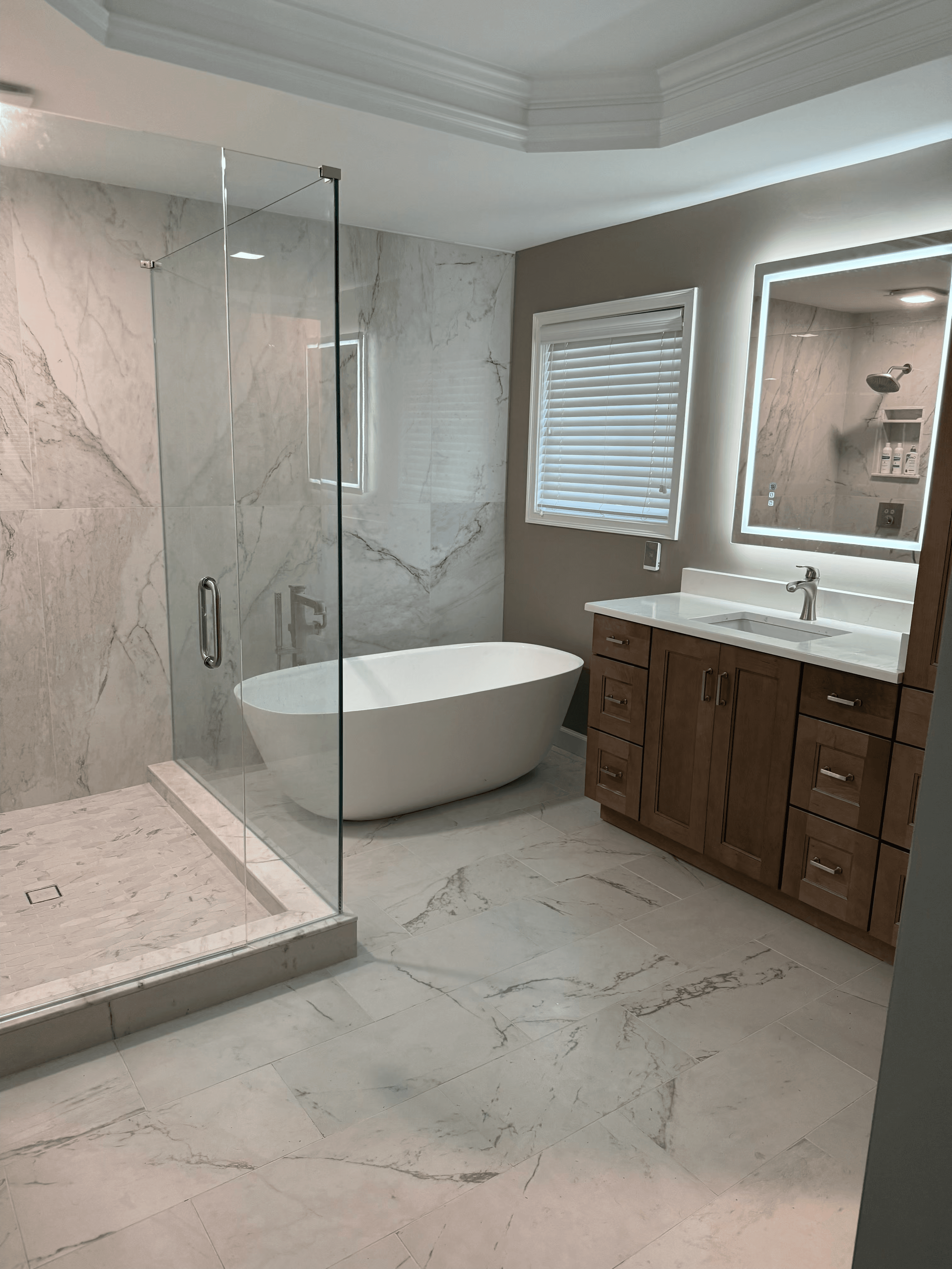 Walk-in shower with modern tile and built-in bench