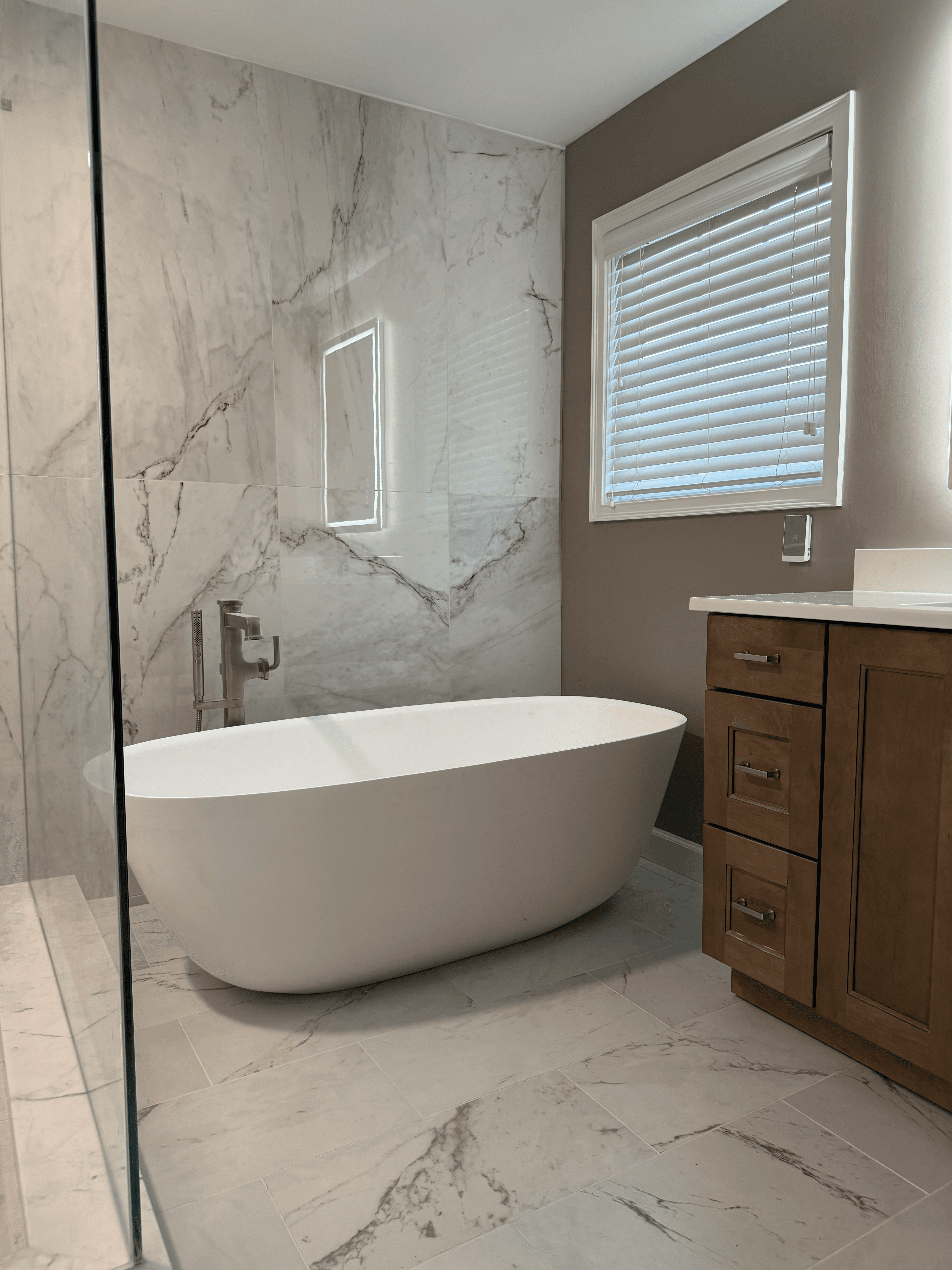 Walk-in shower with modern tile and built-in bench